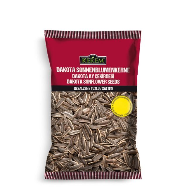 Eine rote Packung Kerem Sonnenblumenkerne geröstet und gesalzen. Dieses Produkt hat ein Preisschild (1,29€)